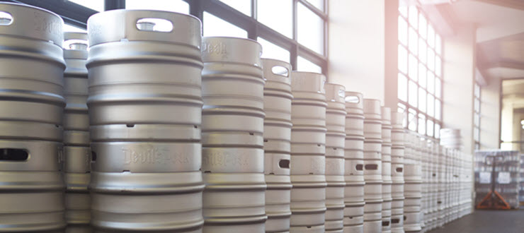 Multiple beer kegs in warehouse